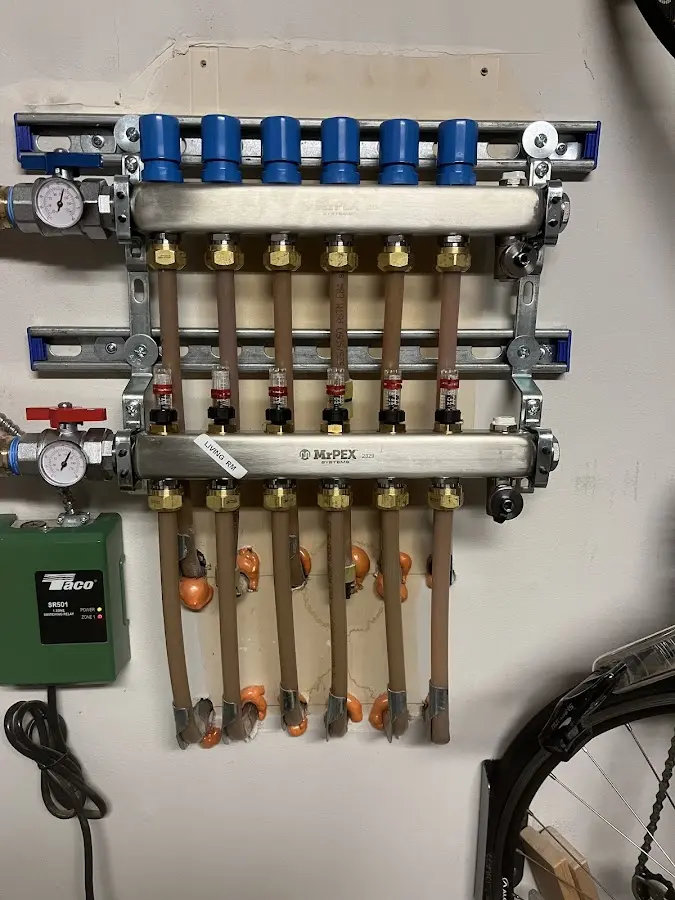 Plumber performing Water Heater Repair at a residential property in Perry